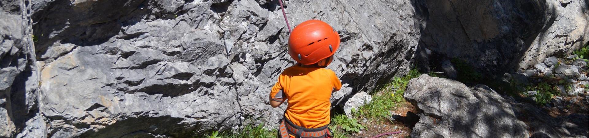 A little kid who is climbing