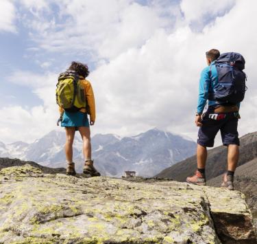 Two hikers near the Düsseldorferhütte/rifugio Serristori mountain shelter